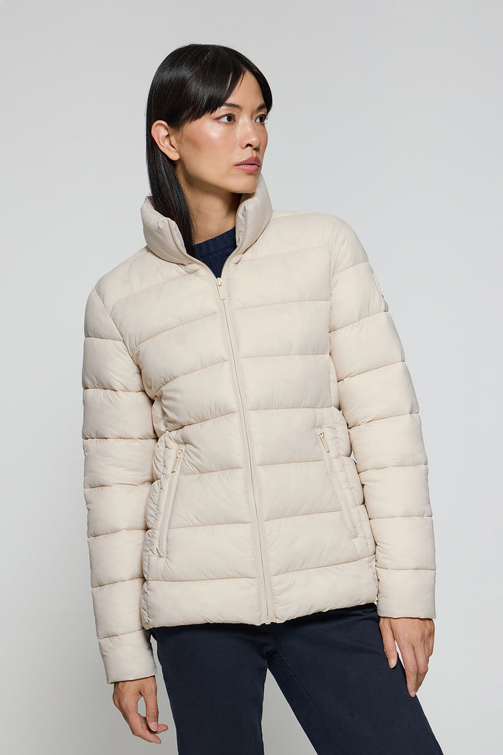 Beige ultralight jacket Susanne with Rigby Go patch