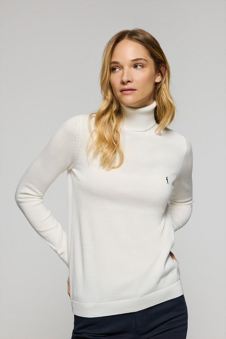 Nude turtleneck knit jumper with Rigby Go embroidered logo