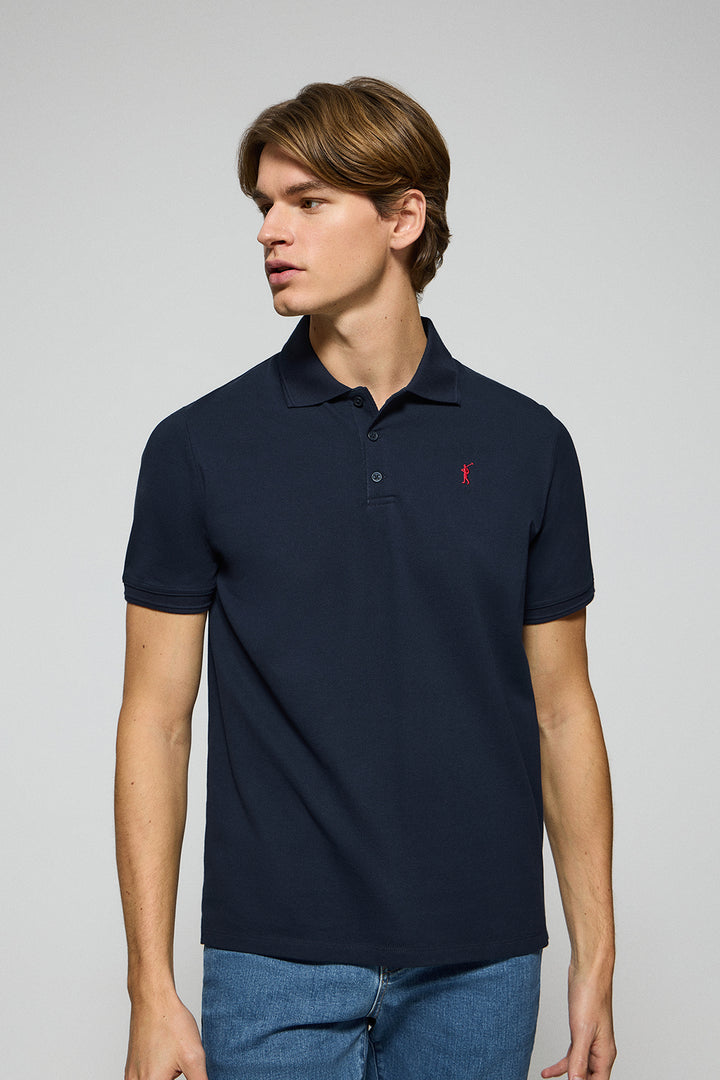 Navy-blue polo shirt with three buttons and Rigby Go embroidered logo