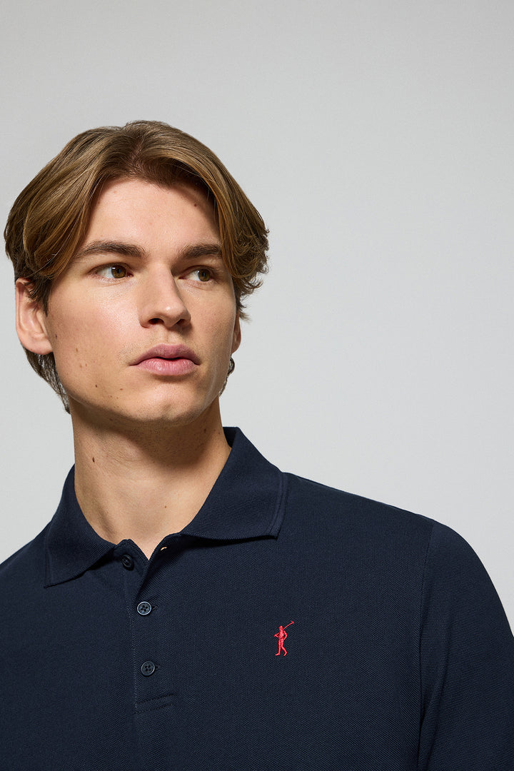 Navy-blue polo shirt with three buttons and Rigby Go embroidered logo