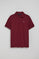 Maroon polo shirt with three buttons and Rigby Go embroidered logo