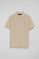 Beige polo shirt with three buttons and Rigby Go embroidered logo