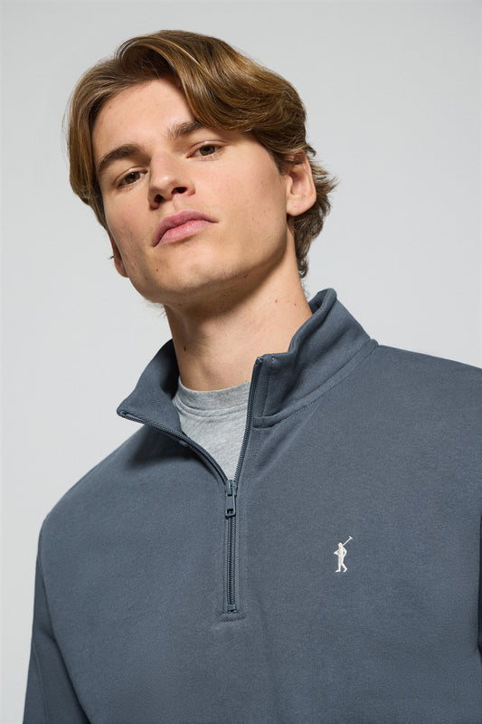 Denim-blue half-zip sweatshirt with Rigby Go embroidered logo